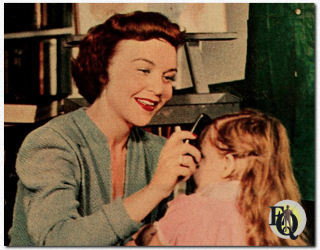 In "Road of Life", Marion Shockley plays Carol Brent, seen here with her daughter Janie. Marion plays Dr. Jim's beautiful, petite wife. All her strenght of character and bitter experience are needed to make her marriage a success.