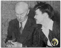 Arthur Allen (Doc Prouty) polishes his glasses to better see Marion Shockley (Nikki Porter).