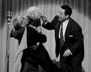 Florenz (as Mr. Julius Dithers) is swept of his feet when the Glamour Girl (Barbara Nichols) gets hold of him in an episode of "Blondie" (April 5, 1957). Harold Peary watches closely.