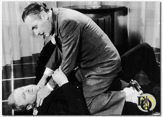 Lew Cody "strangling" Wade Boteler in the A. Edward Sutherland Comedy "The Baby Cyclone" (1928), based on the play by George M. Cohan.