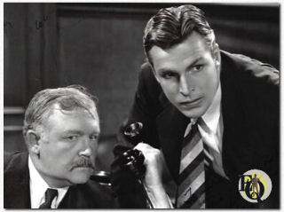 Wade Boteler (L) and Buster Crabbe in "Red Barry" (1938)