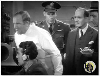 Buck Rogers (Universal, 1939), a futuristic adventure serial that starred Red Barry’s lead Buster Crabbe, gave Boteler a small but important first-chapter role as Professor Morgan–the scientist who, via radio, instructed trapped aviators Buck Rogers (Crabbe) and Buddy Wade (Jackie Moran) in the use of the suspended-animation gas that could alone save their lives.