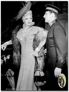 Richard Coogan as Captain Cummings and Mae West as the title role in "Diamond Lil".