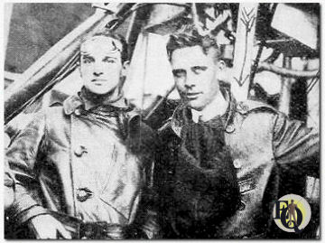 Lieutenant Darmour (right), whose subjects have frequently been referred to in the cameramen department, as first Lieutenant in the Signal Corps.