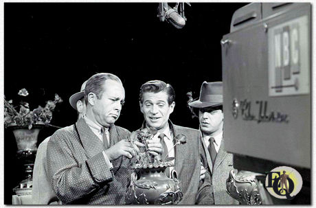 Production still (1958) for an unknown episode of "The Further Adventures of Ellery Queen" (NBC, 1958), George Nader as Ellery Queen in the center of the picture.