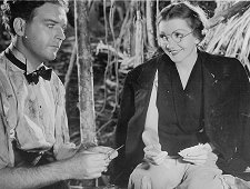 Stewart Corder (William Gargan) with schoolteacher Judy Jones (Claudette Colbert) in "Four Frightened People" (1934).