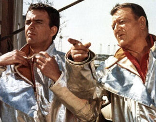 Jim Hutton as Greg Parker, the right hand of Chance Buckman (John Wayne) in "Hellfighters" (1968).