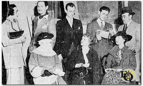 The professional company of the "Binghamton Repertory Theatre", scanning their lines for the last time before the first performance of "When Ladies Meet" at the Masonic temple (May 14. 1936). Left to right, front row: Gertrude Bondhill, Virginia Stevens, Jean Arden. Back row: Dorothy Kennedy, John Vosburgh, Donn Bennett, Warren Douglas and Edward B. Latimer, the director. 
