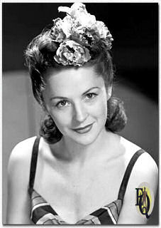 Helen Lewis models hair styles for a portrait in New York City. She has a role in the soap opera "Kate Hopkins, Angel of Mercy" (April 7, 1941)