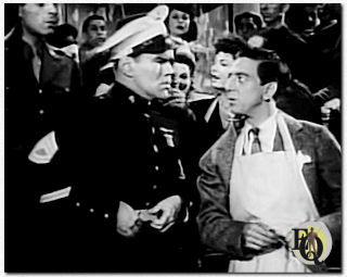 In "Stage Door Canteen" (1943) was hij een Marine Sergeant (zonder vermelding in de rolverdeling) tegenover Ray Bolger. Klik op de foto om de clip uit de film te zien...