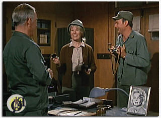 In several episodes of "M*A*S*H", his real wife, Eileen Detchon (also seen in the photo below left), appeared as the spouse for his character. "Mildred's" photo was prominently displayed on the Colonel's desk (1975).