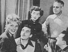  For the "Ford Theatre" episode "She Loves Me Not" (1949) director Marc Daniels (R) instructs (L to R) Judy Holliday, Richard Hart, Marsha Hunt, Paul Stewart.