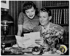 Marian Shockley and Bud Collyer. Never on to shirk his chores or what he considers his duties, Bud is a conscientious mail answerer. (Dec 1951)