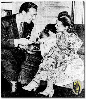 Alice Reinheart and her husband Les Tremayne, claim their fox terrier Weaf is the smartest dog in town. "We have had to spell in front of him for a long time," Miss Reinheart says, "but now he is starting to correct our spelling." (Jan 1947)