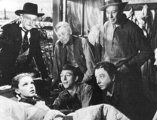 Tegenover Judy Garland, Charley Grapewin als de beminnelijke Uncle Henry in de klassieker, "The Wizard of Oz" (1939).