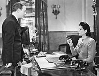Mrs. Van Dorn (Gale Sondergaard) has the drop on Ellery Queen (William Gargan). In mystery films, Sondergaard is most famous for playing the title character in "The Spider Woman" (1944), from the Sherlock Holmes series.