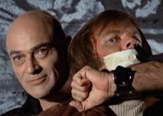 Dobkin as mass murderer Gregory Praxas in a 1972 pilot film for "Streets of San Francisco" holds David J. Farr (Robert Wagner).