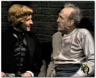 In Edward the Seventh (1975) Charles Sturidge als de jonge Edward in gesprek met een gevangene, gespeeld door Elliott Sullivan.